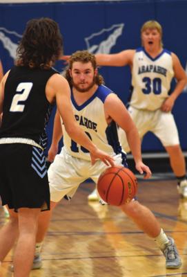 Arapahoe’s Cord Frink guards the ball against Wilcox-Hildreth.