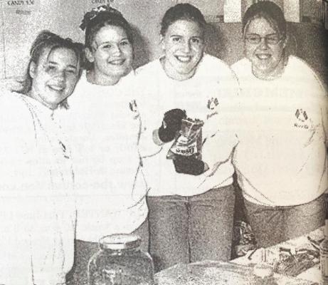 FLAG SQUAD PROJECT - These girls were among many youths earning funds for different activities by selling food at the 2001 Applefest in Orleans last weekend. Show selling Tacos in a Bag were, l to r: Jackie Carpenter, Vanessa Robbins, Danielle Einspahr and Janelle Schoen. Funds raised were to help with summer camps and new flag squad equipment. This is the third year the Southern Valley members have participated at Applefest.