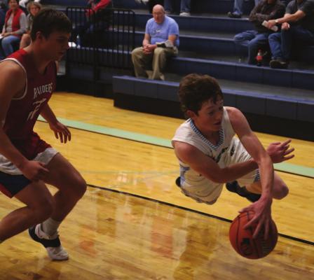 Southwest’s Nate Rippe dives to save a ball in-bounds against Medicine Valley.