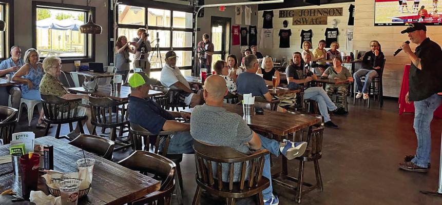 U.S. Senate candidate Dan Osborn speaks to a group at the Big Johnson Brewing Company at Johnson Lake Thursday.