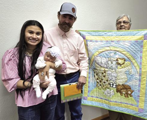 Frontier County Quilt Guild was honored to gift Indy May Stout a handmade quilt in honor of being the first baby born in the Curtis community. Indy, born January 2nd, is the daughter of Curtis residents Reid Stout and Maiya Dehoyos. Every year, Frontier County gifts the first baby born within 15 miles of Curtis with a handmade quilt. Frontier County Quilt Guild member Linda Fisher is pictured presenting the quilt to the Stout-Dehoyos family.
