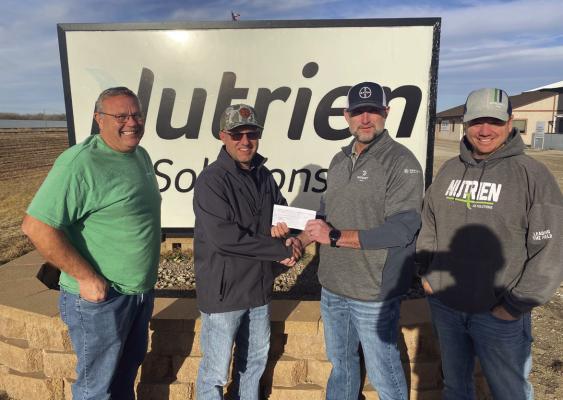 Nutrien presents sales proceeds to local fire departments
