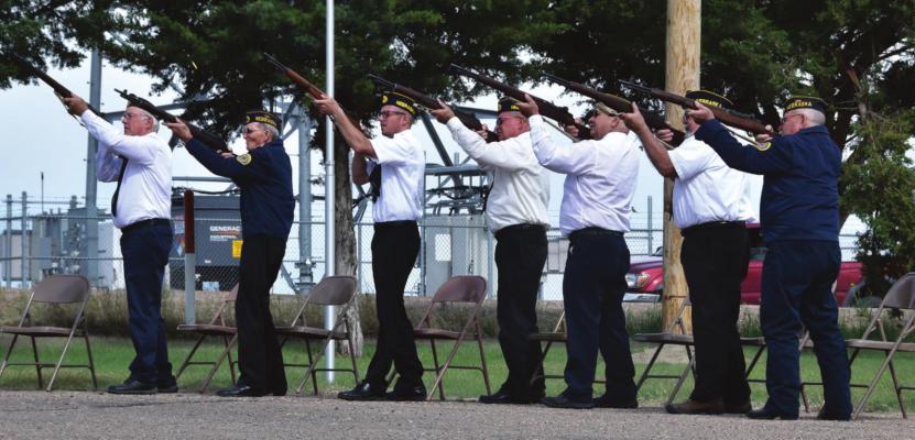Cambridge American Legion Post 199 members honor the dead with a gun salute during their Memorial Day Service Monday morning.