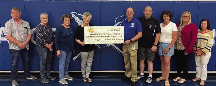 The Arapahoe Area Foundation along with the Arapahoe Gala Committee presented the Arapahoe-Holbrook Public Schools with a check of $37,850 from the Gala Event held in April. Pictured l-r: Arapahoe Area Foundation Board Members: Kevin Urbom, Sherry Cacy, Cathy Schievelbein, and Kristie Warner. Elementary School Principal Benjamin Ellis, School Board Representative Erick Lee and Arapahoe Gala Committee members: Julie Stagemeyer, Alexis Barnes and Jennifer Einspahr.