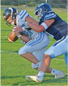 Southwest’s Hunter Blume strips the ball from a Wilcox-Hildreth runner.