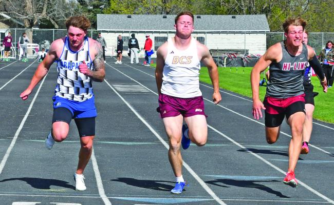 Arapahoe’s Will Cacy nipped both Dundy County-Stratton’s Laken Wissink and Hi-Line’s Asher Hecox at the line to claim first in the 100-meter dash.