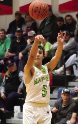 MHC’s Kade Broz launches a three from the wing.