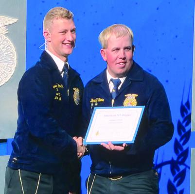 Donald Rohr (right) receives the American Degree at National FFA Convention