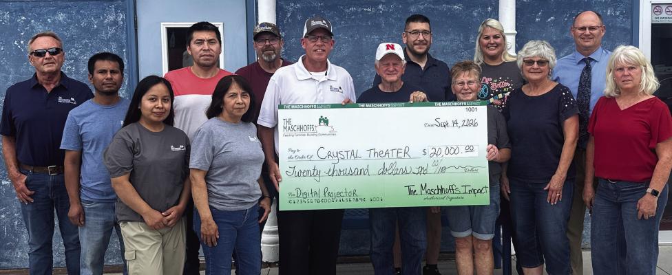Pictured at The Maschhoffs check presentation to the Crystal Theater are, front row left: Carmen Zamora Bernardino, Celia Martinez, Mike Harris, Don Sandel, Connie Hoefs, Linda Hamel and Bev Osiecki. Back row: Roger Hinz, Luis Javier Salomon Victoriano, Alejandro Canas Navarro, Harley Lambert, Erick Lee, Tiffany Downey and Ben Ellis.