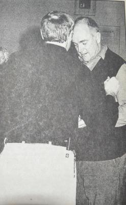 CONGRATULATIONS - Southern Valley Head Coach Mike Lanham accepts his championship medal from Cambridge Assistant Girls Basketball Coach Don Sackett after Lanham’s girls team won the 2001 RVL Tournament Saturday night, Jan 27, 2001 at Cambridge. The Lady Eagles defeated Alma in a hard fought game 58-54.
