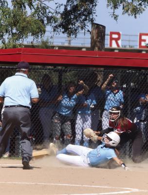 Southern Valley/Alma’s Kaitlyn Bradley slides in ahead of the tag on a steal of third base Monday.