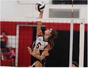 Cambridge’s Jalen Kent attacks a ball from the pin.