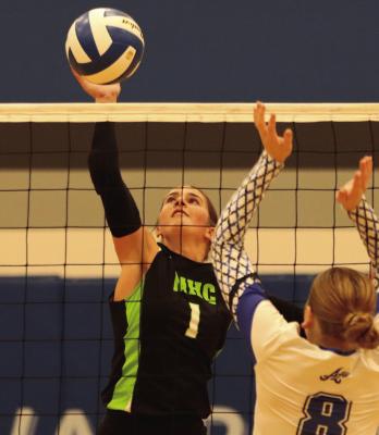 The Wolves Blayklee Farr tips an attack against Arapahoe.