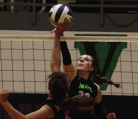 MHC’s Caylie Softley battles at the net.