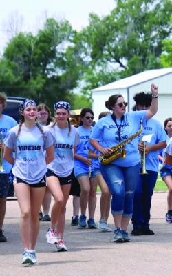 The Southwest Marching Band makes its way down the street.