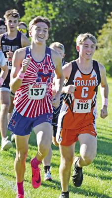 Medicine Valley’s Kael Garrett and Cambridge’s Gavin Gunderson lead the pack at the start of last week’s Arapahoe Invite.