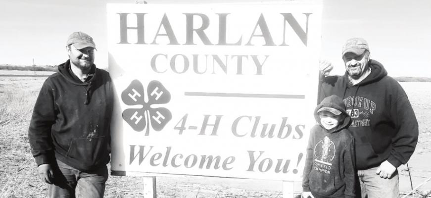 Volunteers Brent Dunse, Marcus Schultz and Mike Schultz installed three new 4-H signs along highways 136 and 183 in February. Photo Credit: Dawn Hetrick
