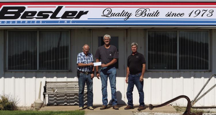 Besler Industries, Inc. auctioned off a Besler Bale Bed and Utility Flatbed, giving $20,000 (100%) in proceeds from the auction to the Cambridge Volunteer Fire Department. The auction was held on Big Iron. Delaine Soucie of Cambridge had the highest bid for the Flatbed and Charles Fritsche of McCook had the highest bid for the Bale Bed. Pictured above L to R: Herb Besler, Delaine Soucie (Fire Chief) and Cliff Kester.