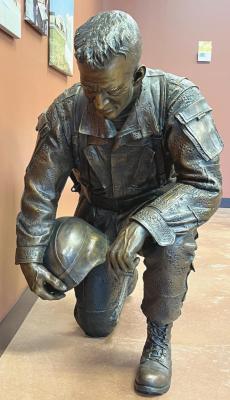 Planned for installation this fall at the Veterans Memorial Park in Holdrege, a Lundeen sculpture depicting a kneeling soldier paying respects to a fallen comrade.