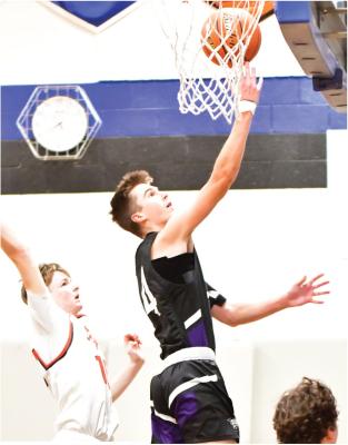 Isaac Hamilton cuts to the rim for a layup against Franklin.