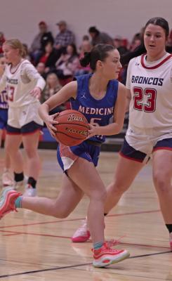 Medicine Valley’s Kamree Elsten drives into the paint.