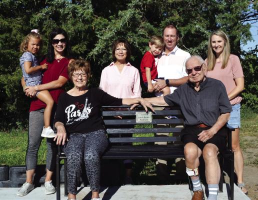 Pictured with the new bench are the Vondraceks and some of their family. Seated – Rosalie and John Vondracek. Back l to r: Makayla Wilkin, Kylie Fox Wilkin, Kathy Fox Gibb, Cameron Fox, Nate Fox, Katrina Fox.