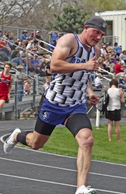Arapahoe’s Will Cacy set a meet record with a 49.07 in the 400-meter dash Saturday.