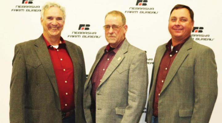 Members of Harlan/Furnas County Farm Bureau attended the Nebraska Farm Bureau Annual Meeting and Convention in Kearney Dec. 6 and 7. Pictured from left are Tony Anderson of Alma; Douglas Winz of Holdrege; and Nicholas Holste of Oxford.