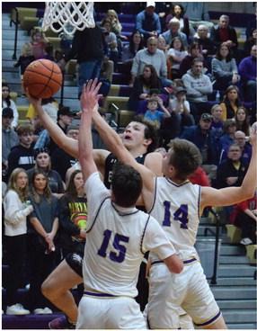 Southern Valley’s Mitch Wilson powers up for a shot in the lane.