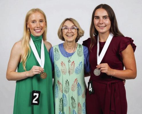 Pictured are Olive Clark, Barb Lund-Irvin (scholarship sponsor) and Kara Brockman.