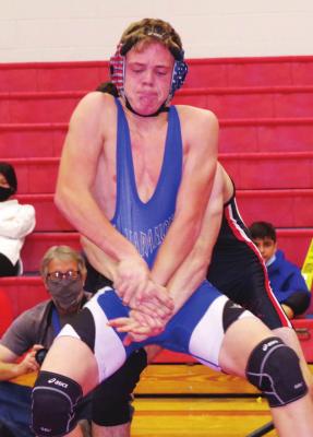 Arapahoe’s Rafe Hill tries to get score an escape during a match at Pleasanton Saturday.