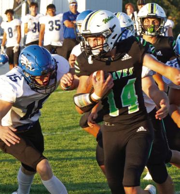MHC’s Grady Erickson tries to break free from tacklers.
