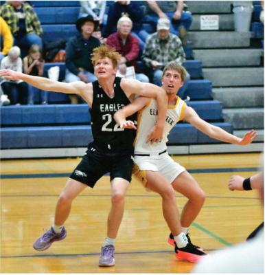 Tylor Grove battles for rebounding position.