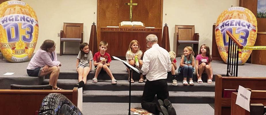 Evangelical Free Pastor Wes Holen gives a lesson during the Community Vacation Bible School at the Oxford First Baptist Church on July 5 - 7.