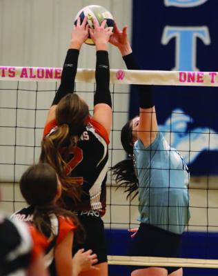 Cambridge’s Brooklyn Holtze jousts at the net with Southwest’s Aspen Billeter.