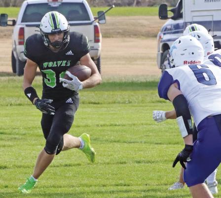 MHC’s Sawyer Dibbern looks for running room.