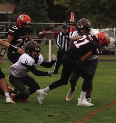 Cambridge’s Jaden Ruf powers in for a two-point conversion.