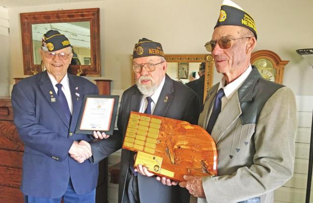 American Legion Post 344 Adjutant Russ Wood (left) and American Legion District Nine Commander Dennis Kennedy (right) present John Hanson (center) with the 2021 Cornerstone Award.