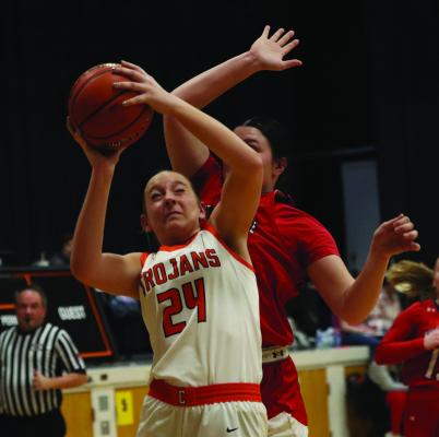 Cambridge’s Brylyn Springer anticipates contact on a layup.