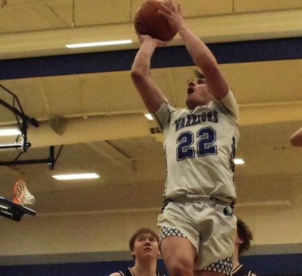 Arapahoe’s Will Cacy rises in the lane and scores against Hi-Line.