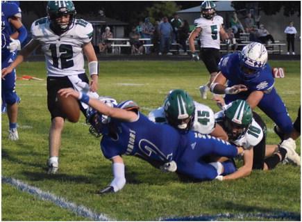 Arapahoe’s Trenton Roskop stretches for the goal line on a run against Loomis Friday.
