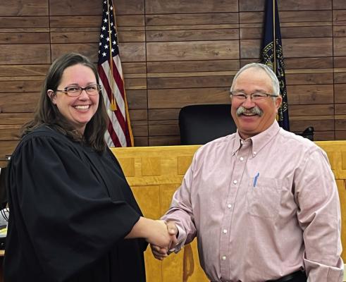 Arapahoe’s Allan McCoy was sworn onto the Furnas County Board of Commissioners Tuesday morning, filling the District 3 seat. He is pictured with Clerk Magistrate Raquel Dringman.