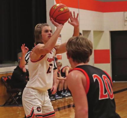 Cambridge’s Will Taylor launches a three against Maxwell.