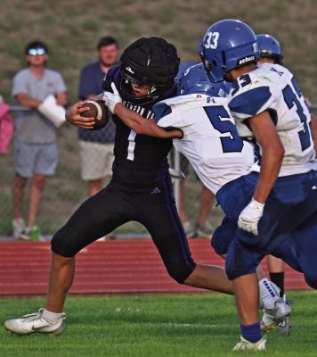 Southern Valley’s Hunter Lans runs through a tackle attempt.