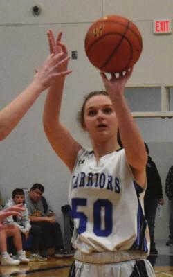 Arapahoe’s Haiden Garey fires a jumper.