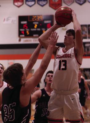 Cambridge’s Ben Hoberty pulls up for a jumper in the lane.