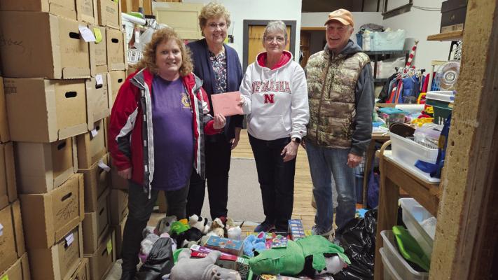 Tri Valley Health System Auxiliary Thrift Shop volunteers Pat Downer and Sharon Lightle presented four totes of new toys and games to Lions Club members for the annual Lions Christmas project. They also shared 50 ten dollar gift certificates to the Thrift Shop for the Lions to include in their gift baskets. Merry Christmas from the TVHS Auxiliary.