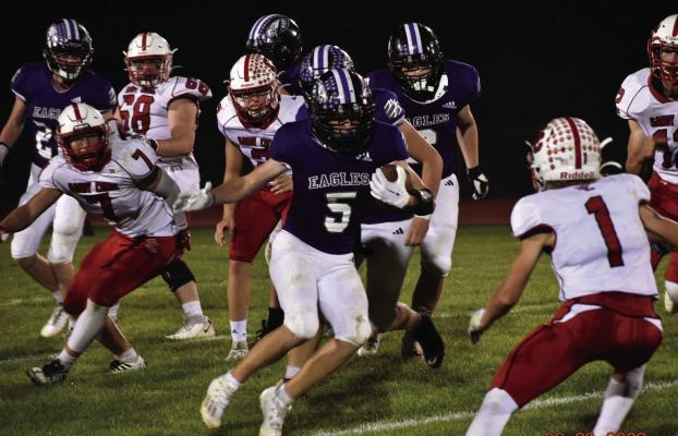 Southern Valley’s Rian Grove looks for running room against Sandy Creek.
