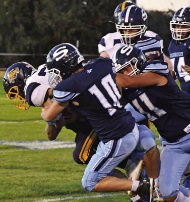 Southwest’s Damario Koetter and Hunter Blume combine on a tackle.