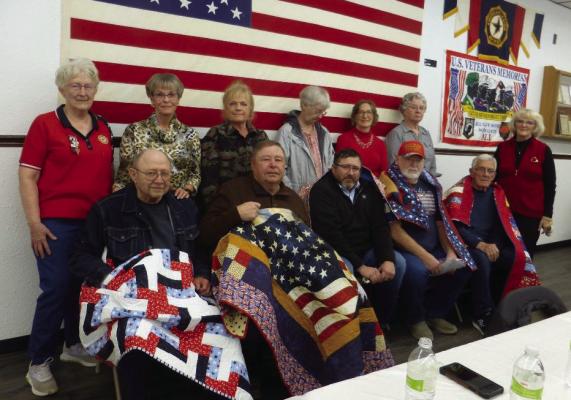 Participating in the quilt presentation were: Front- Allen Schmeeckle, Dick Tobler, JB Houlden, Glenn Hofman and Keith Withers; back row- Kathy Beck, Connie Schmeeckle, Carol Tobler, Chris Williams, Carol Hofman, Velma Withers and Marty Kleppinger.